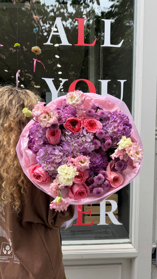 “Lilac Volume” Bouquet (Pink Garden Roses, Purple Hydrangeas, Lisianthus, Buttons)