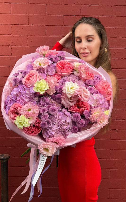 “Lilac Volume” Bouquet (Pink Garden Roses, Purple Hydrangeas, Lisianthus, Buttons)