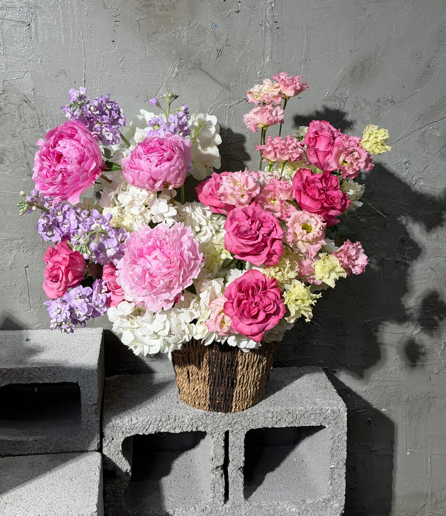 “Pink Champagne” Basket (Country Blues Roses, Peonies, Lisianthus, Stocks, Hydrangeas)