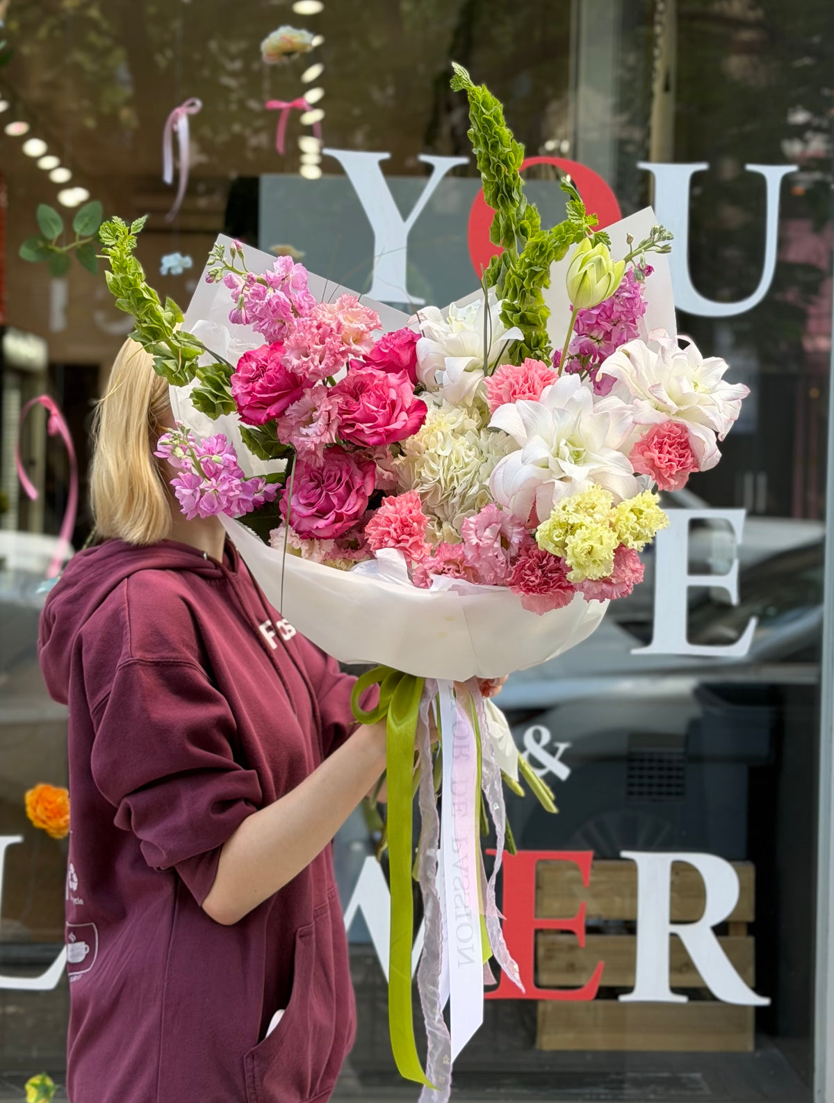 “Berry Fizz” Bouquet (Peony Lilly, Country Blues Peony Roses, Lisianthus, Hydrangea, Stocks, Bear Grass, Carnations, Bells of Ireland)