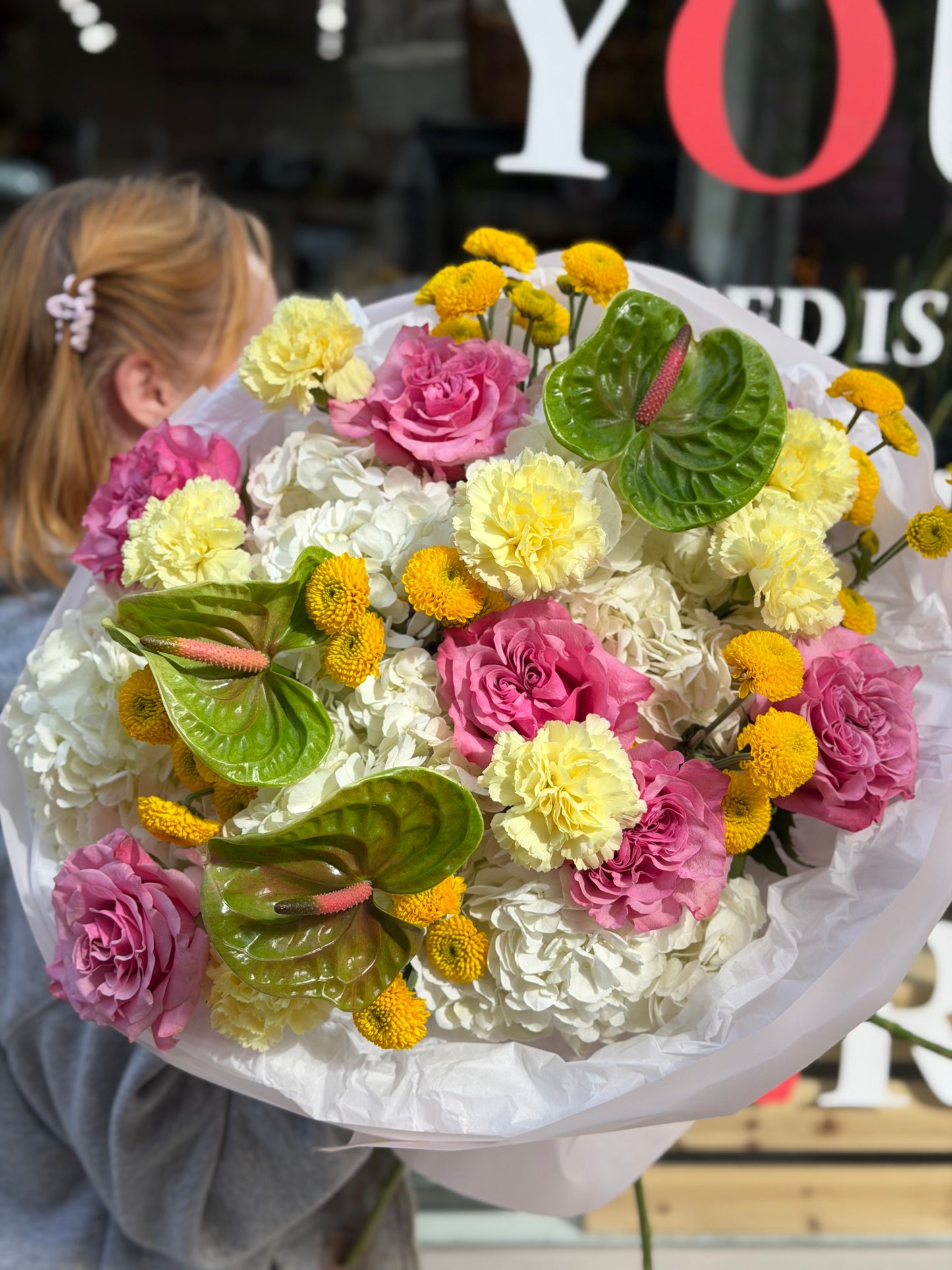 “Certified Rizz” (Garden Roses, Anthurium, Hydrangeas, Buttons, Carnations)